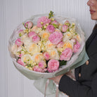 Olivetta luxury bouquet — Candlelight roses, Bridal Piano, and stock in a warm cream-and-blush hand-tied arrangement | Ecoroses Los Angeles