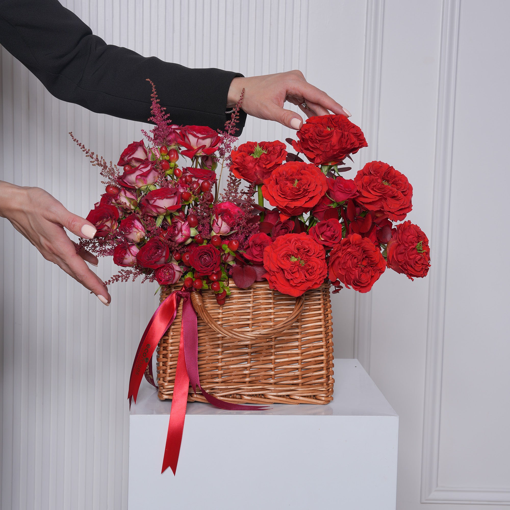 Rossana luxury red rose gift bag — Red Eye roses, red baby roses, and burgundy eucalyptus in a designer gift bag arrangement | Ecoroses Los Angeles